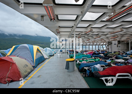 Passenger sleeping in the solarium. Columbia ferry. Alaska Inside Passage. USA Stock Photo