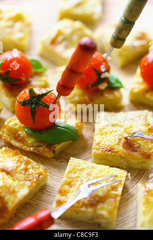 potato tortillas with cherry tomatoes Stock Photo