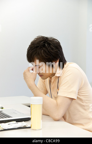 Young man suffering from headache Stock Photo