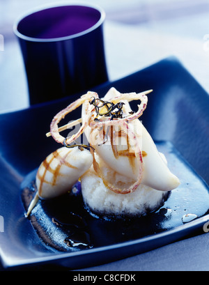 Rice polenta and squid with ink Stock Photo