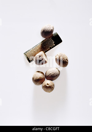 Nutmeg and small grater Stock Photo