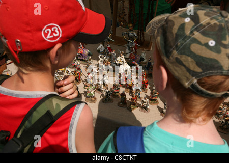 Vendor sells toy solders at the medieval market during the re-enactment of the Battle of Grunwald (1410) in Northern Poland. Stock Photo