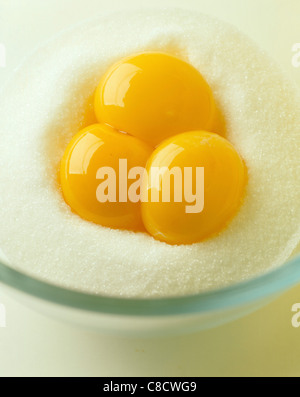 egg yolks in caster sugar Stock Photo