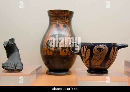Ukraine, Odessa. Archaeological Museum, interior display. 6th-4th century BC, bronze foot from statue, Greek pottery. Stock Photo