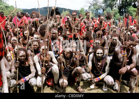 Lolgorian, Kenya. Eunoto coming of age ceremony; moran Maasai warriors with traditional white chalk mud body paint. Stock Photo