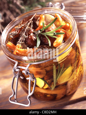 Jar of preserved wild mushrooms Stock Photo