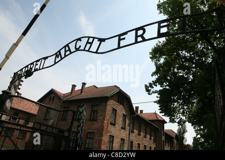Nazi slogan Arbeit Macht Frei over the main gate of the Auschwitz I German Nazi concentration camp in Oswiecim, Poland. Stock Photo