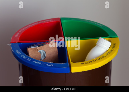 Recycling bin in a hotel room with Portuguese and English text Stock Photo