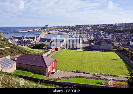 Findochty harbour in Moray North East Scotland with bowling green at the front Stock Photo
