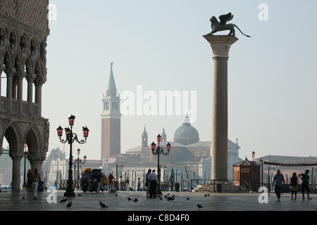 Column with the statue of the Lion of Saint Mark on the Piazzetta on Piazza San Marco in Venice, Italy. Stock Photo