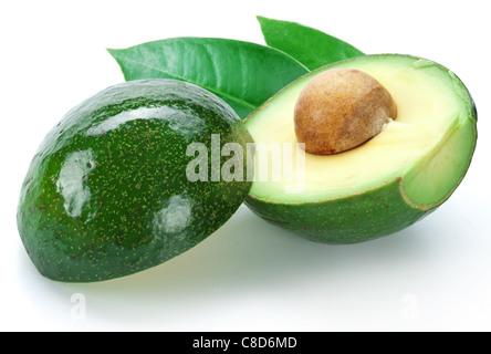 Ripe avocados with leaves on a white background. Stock Photo