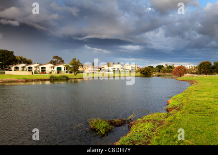 Large lakeside houses beneath a stunning stormy sky in affluent South Perth Stock Photo