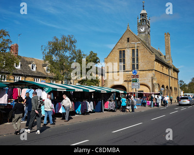 Moreton in Marsh High Street on market day with ancient market hall feature Stock Photo