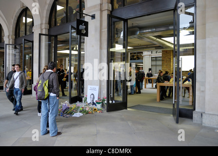 People paying their respects at a makeshift shrine to Steve Jobs outside the Apple Store in London’s Covent Garden. Stock Photo