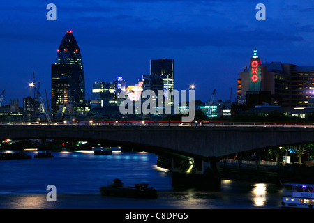Looking across Waterloo Bridge at dusk to the Gherkin and Oxo Tower, London, UK Stock Photo