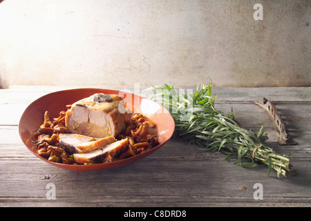 Saddle of rabbit with Foie gras and small pan-fried chanterelles Stock Photo