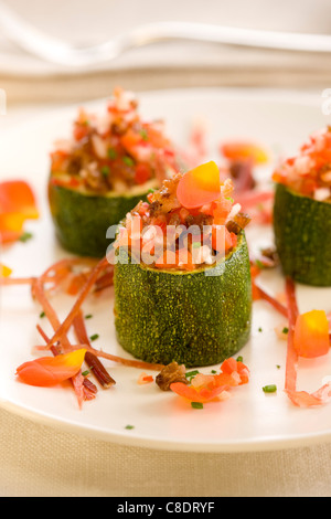 Zucchini sections stuffed with Spanish ham,red peppers and raisins Stock Photo