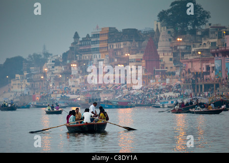 Traditional scenes of tourists on on River Ganges at Varanasi, Benares, Northern India Stock Photo