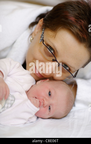 mother and daughter day after birth in hospital Stock Photo