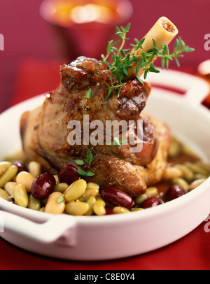 Knuckle of lamb with two types of beans Stock Photo