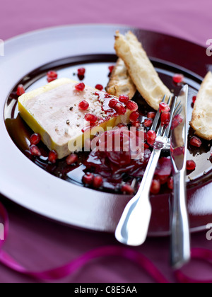 Foie gras terrine with pomegranate seeds and beetroot chutney Stock Photo