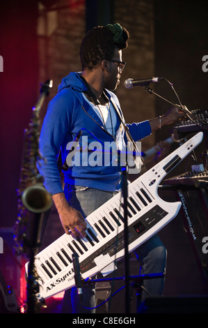 Casey Benjamin playing a Roland AX-Synth shoulder synthesizer on stage with Robert Glasper Experiment Brecon Jazz Festival 2011 Stock Photo