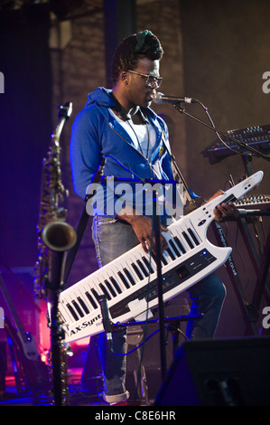 Casey Benjamin playing a Roland AX-Synth shoulder synthesizer on stage with Robert Glasper Experiment Brecon Jazz Festival 2011 Stock Photo