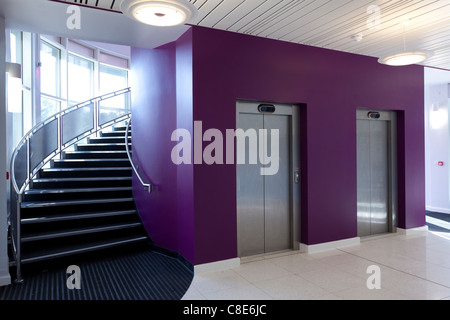 Entrance foyer and curved stair case and lift doors of the Eastpoint Centre, Southampton Stock Photo
