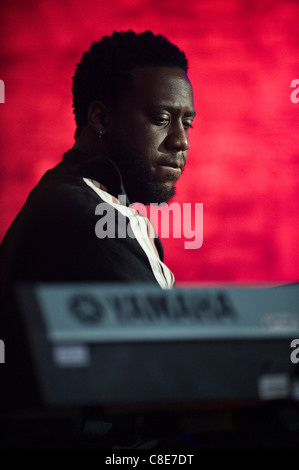 Robert Glasper playing keyboards on stage with his band the Robert Glasper Experiment at Brecon Jazz Festival 2011 Stock Photo