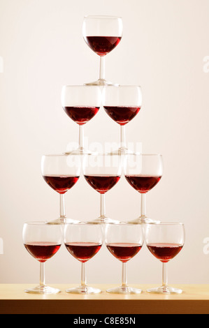 Pyramid of glasses half full of red wine Stock Photo