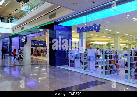 People in Boots pharmacy chemist beauty shop front & window in Westfield shopping centre mall in Stratford City East London newham England UK Stock Photo