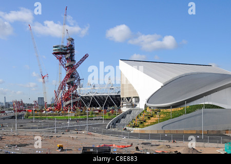 2012 Olympics Arcelor Mittal Orbit tower in the London Olympic park with Aquatics Centre and part of the main stadium Newham East London England UK Stock Photo