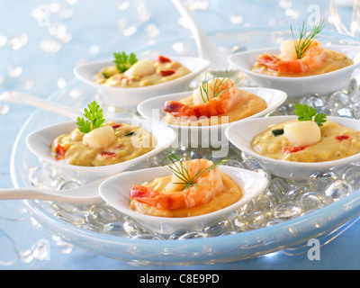 Scallops and shrimps in Cognac sauce appetizers Stock Photo