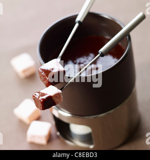 Rose water-flavored marshmallows dipped in a chocolate Fondue Stock Photo