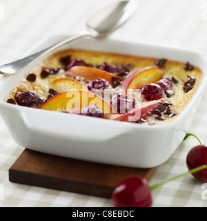 Nectarine,cherry and chocolate chip batter pudding Stock Photo