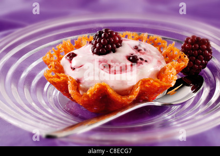 Blackberry mousse in brandy snap basket Stock Photo