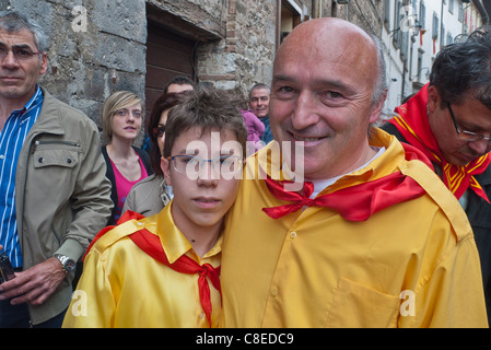 Father and his son, residents of Gubbio, Italy pose in their traditional colors at the annual festival of the 'Corsa dei Ceri.' Stock Photo