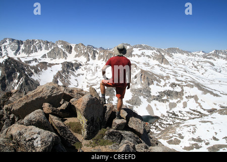 back view of a man standing on mount Emerson enjoying the view Stock Photo
