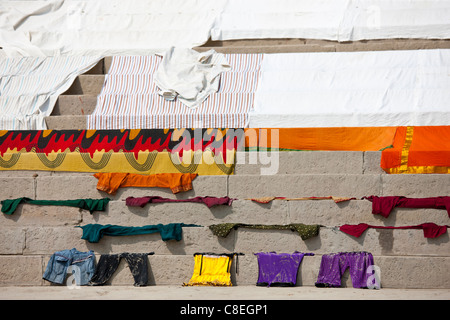 Laundry on the steps of the Ghats by The Ganges River at Kali Ghat in City of Varanasi, Benares, India Stock Photo