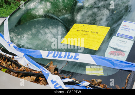 Police notice on an abandoned vehicle Stock Photo