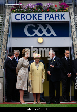 Britain's Queen Elizabeth II walks with Irish President Mary McAleese (L) and GAA President Christy Cooney at Croke Park Stock Photo