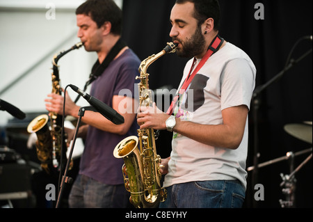 Saxophonists with Led Bib playing on stage at Brecon Jazz Festival 2011 Stock Photo