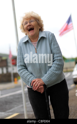 Moneygall, Ireland resident smiles as she prepares for US President Barack Obama Stock Photo