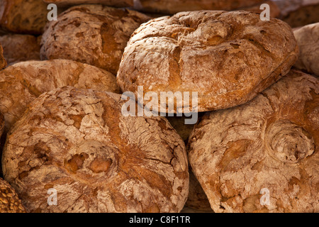 Bread loaves on market stall Stock Photo