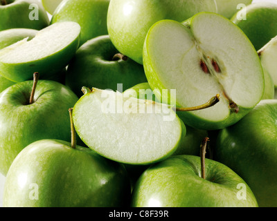 close up of cut and whole fresh Granny Smiths Green Apples arrangement  filling frame Stock Photo