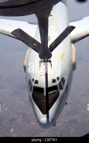 A KC-135 Stratotanker refuels an E-3 Sentry Airborne Warning and Control System here during Cope Tiger '04. Stock Photo
