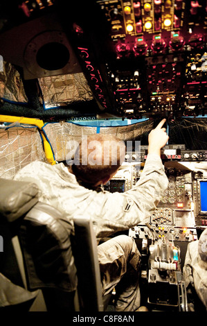 Airman 1st Class Jeremy Lowe conducts a post-flight inspection on a RC-135V/W Rivet Joint Stock Photo