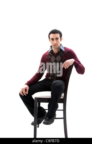 Handsome guy sitting on chair Stock Photo