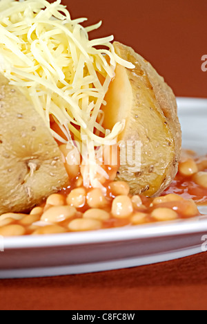 Jacket potato with cheese and beans Stock Photo