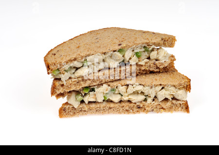Chunky chicken salad sandwich on wholemeal bread on white background cutout. Stock Photo